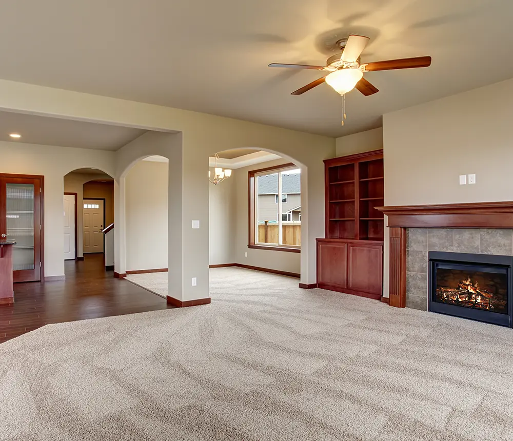 new carpet cleaning in living room with fireplace