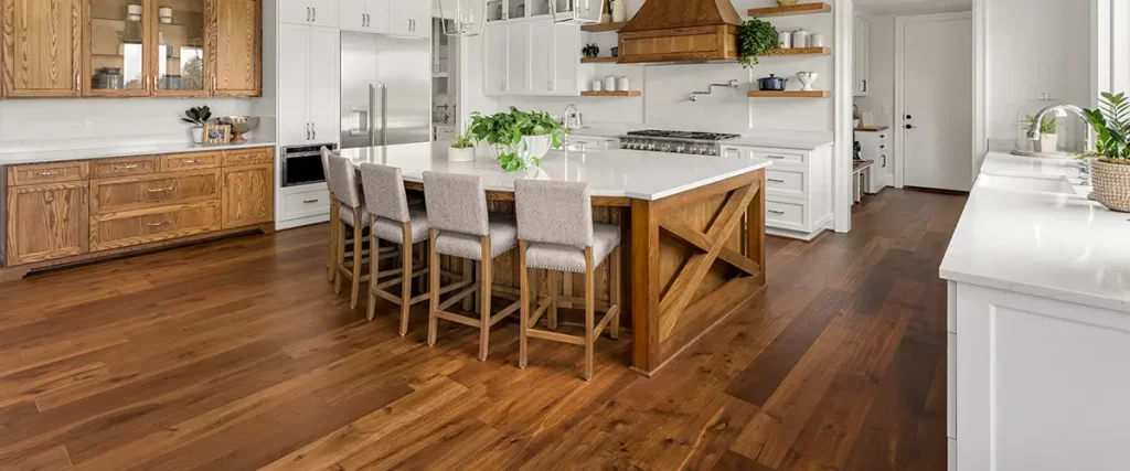 hardwood floors in a large kitchen with wood cabinets
